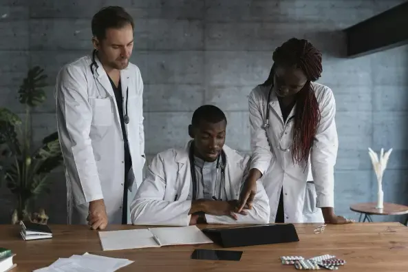 A group of doctors reviewing notes.